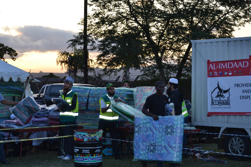 The distribution of mattresses and blankets extended until after sunset to ensure the camps residents did not have to sleep on the cold floor